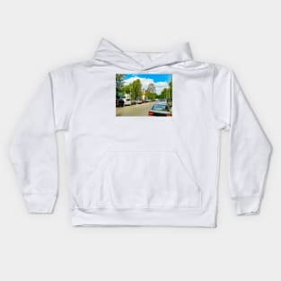 Street of the city. Parked cars. Clear weather. Tram rails Kids Hoodie